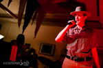 The cops show up to bust the summit... with song!
