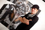 Hans proudly in front of his work