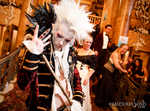 A man on stairs with hair of white, has wandered the party throughout the night.